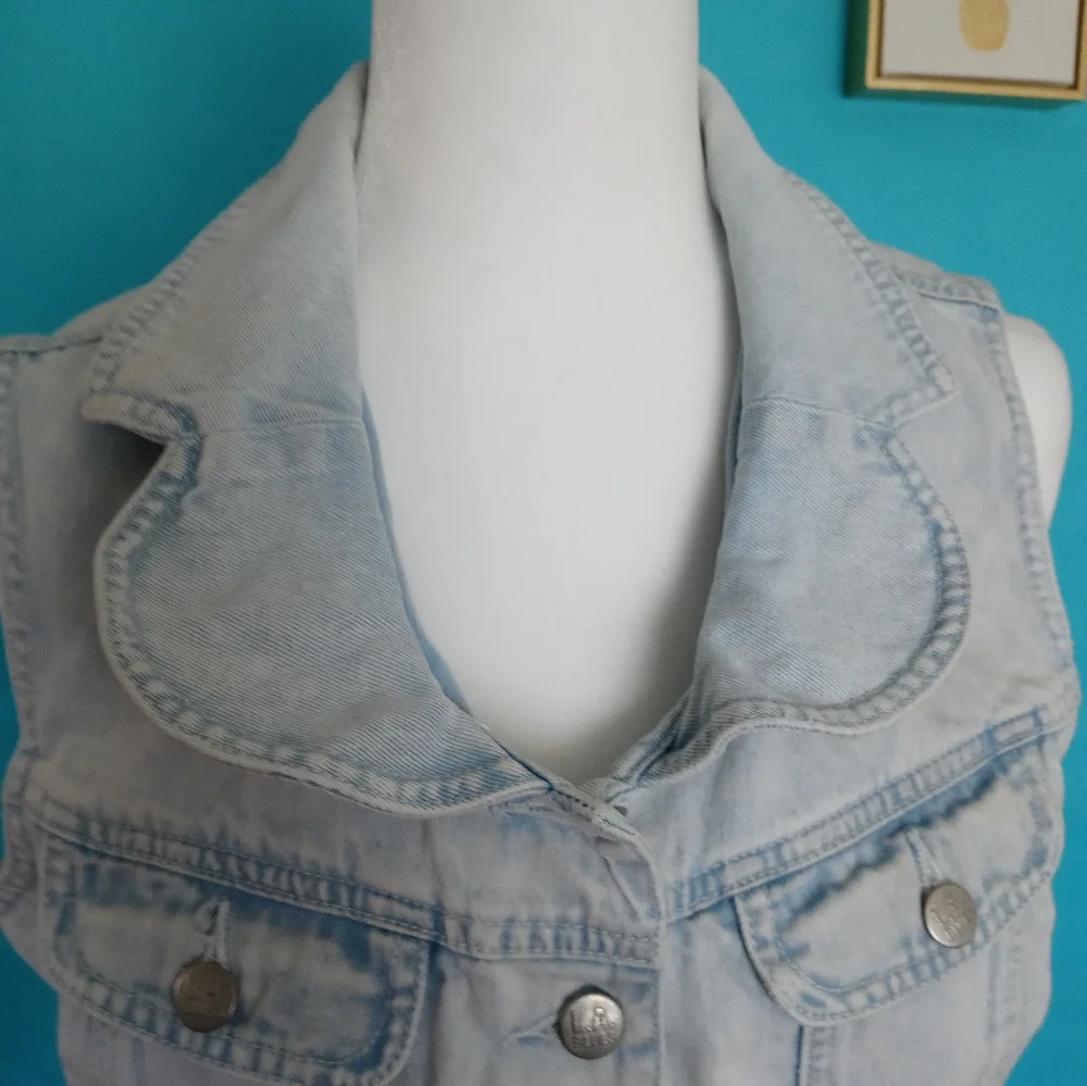 Vest L A . Blue  with a lace heart in the back  size  Large girls color light